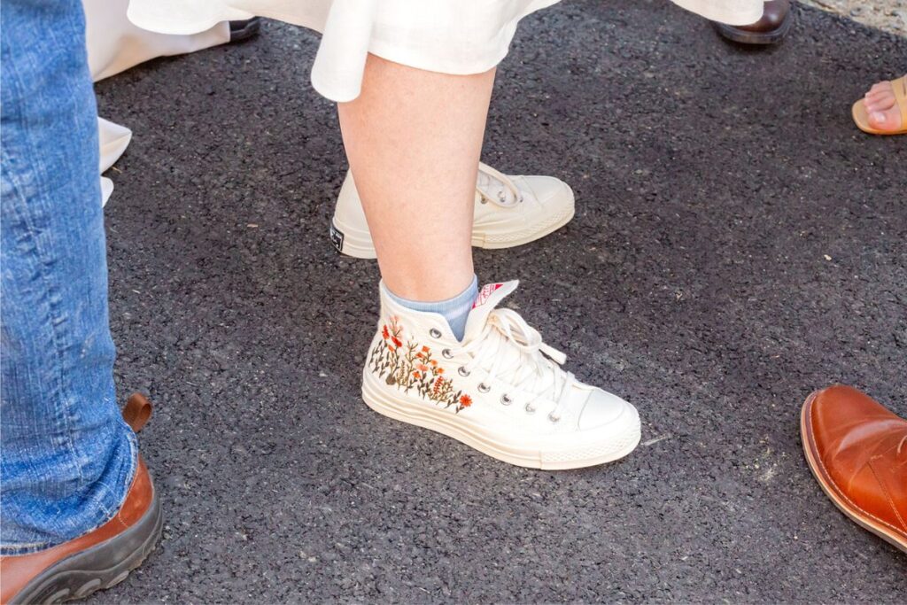 Custom design sneakers as a part of a wedding outfit instead of heels