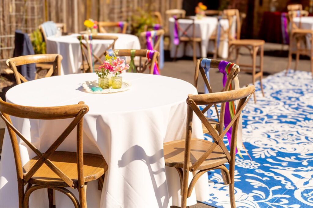 colorful ribbons decorating chairs as a part of the nontraditional wedding ideas