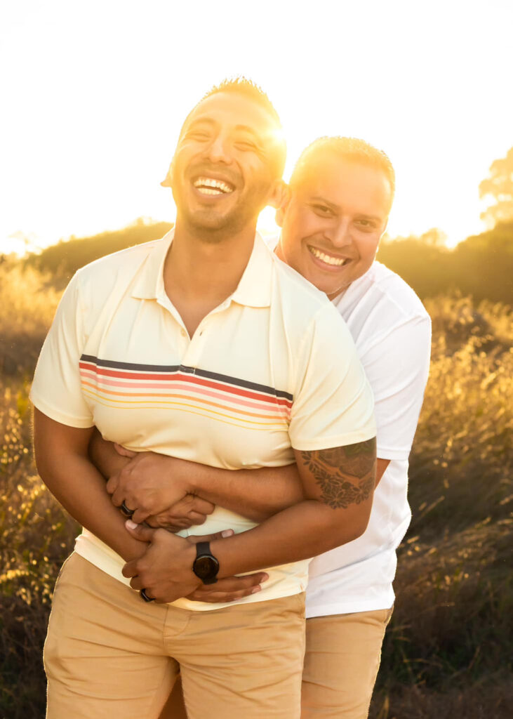 a couple hugging and laughing feeling in love