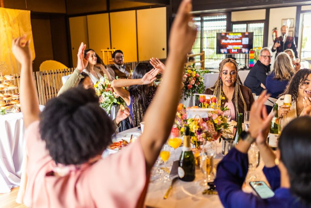 Wedding guests playing trivia at a reception party 