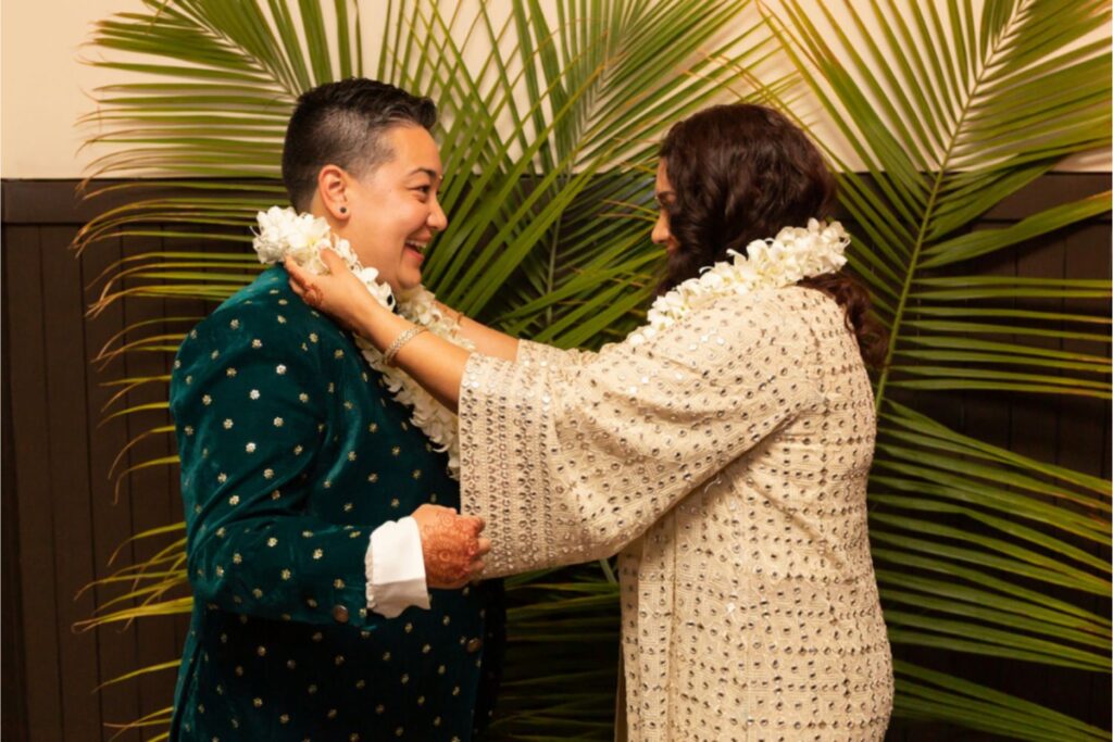 tropical lgbt wedding with palm tree leaf backround