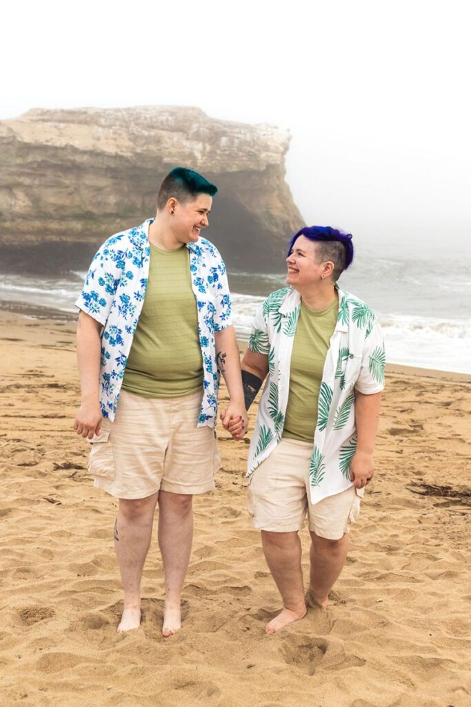 a couple posing by the beach for their Santa Cruz engagement photos