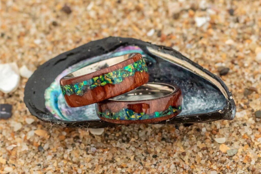 Wedding rings stashed in a seashell