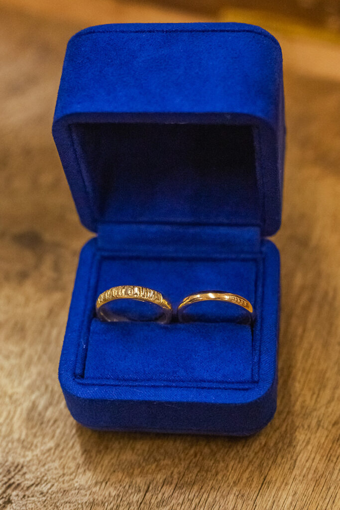 Two engagement rings in a blue ring box 