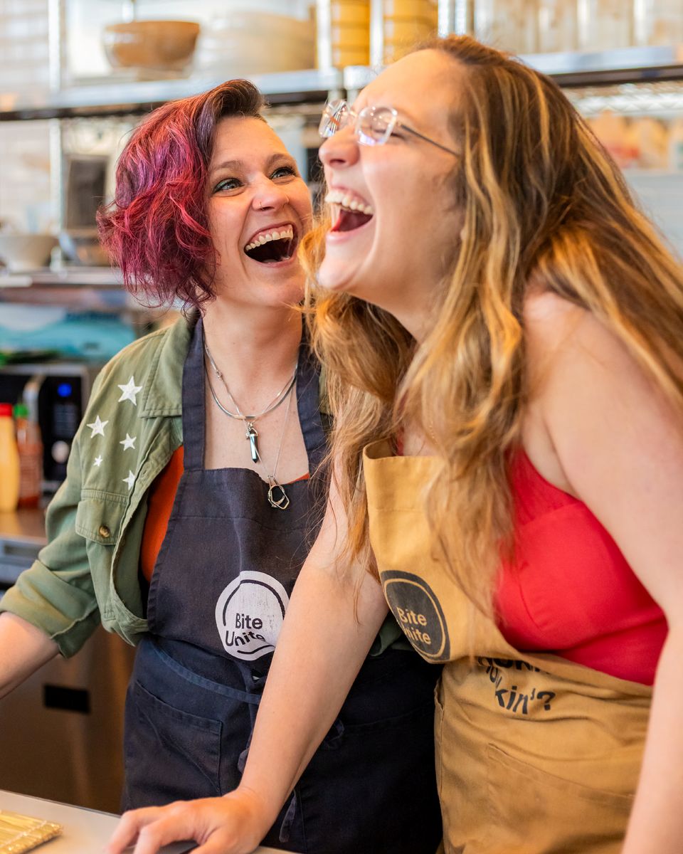 a couple laughing together at a sushi class at biteunite in san francisco