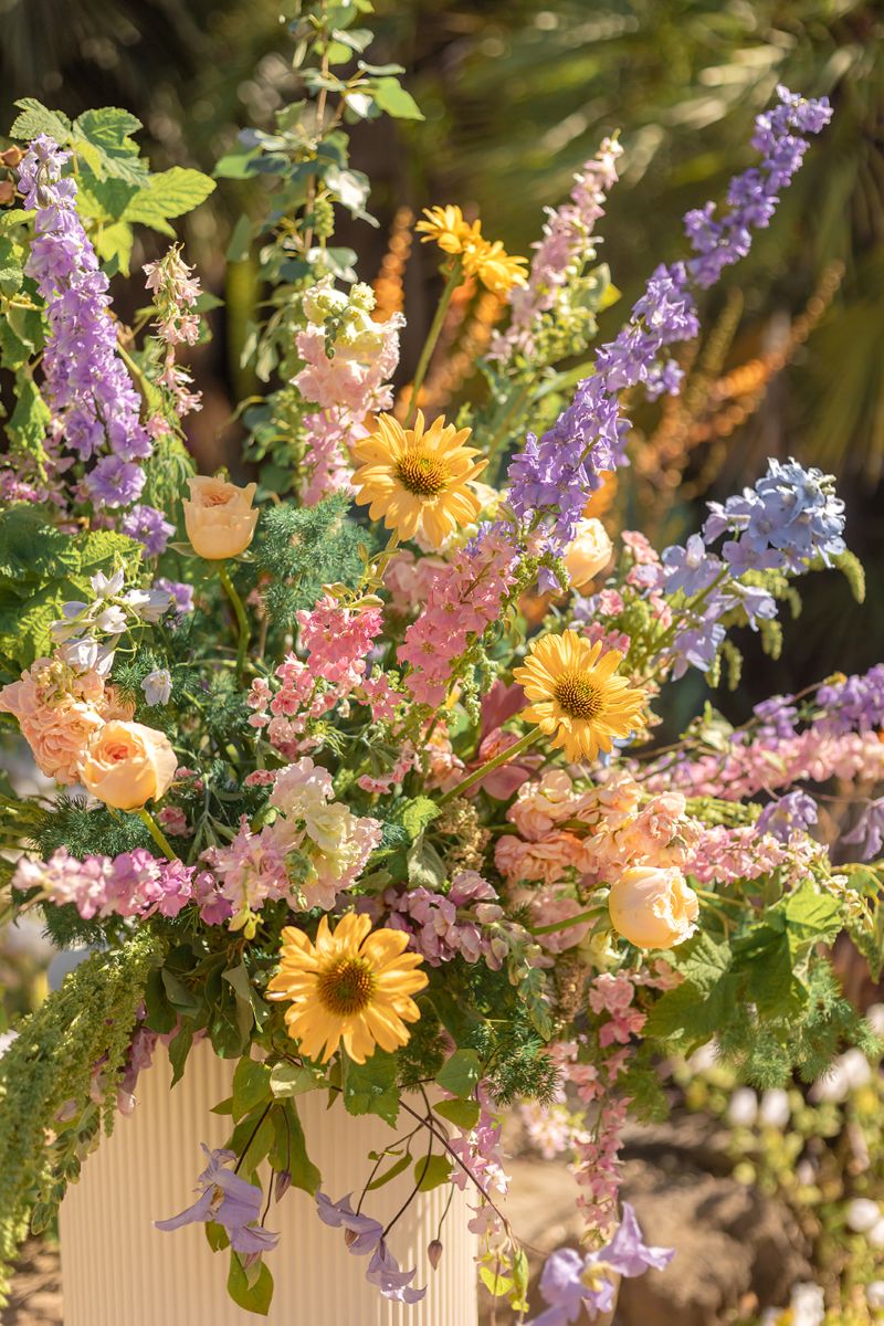 colorful flowers consisting of purple, yellow, and pink at a wedding