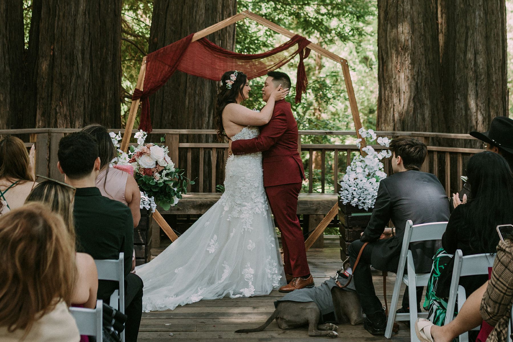 a queer couple having their wedding at peterson grove in sanboron county park