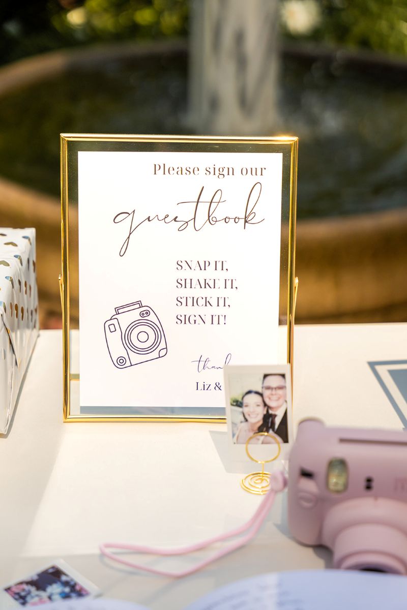 wedding decor including a polaroid camera on a table for a wedding at camfron stanford house 