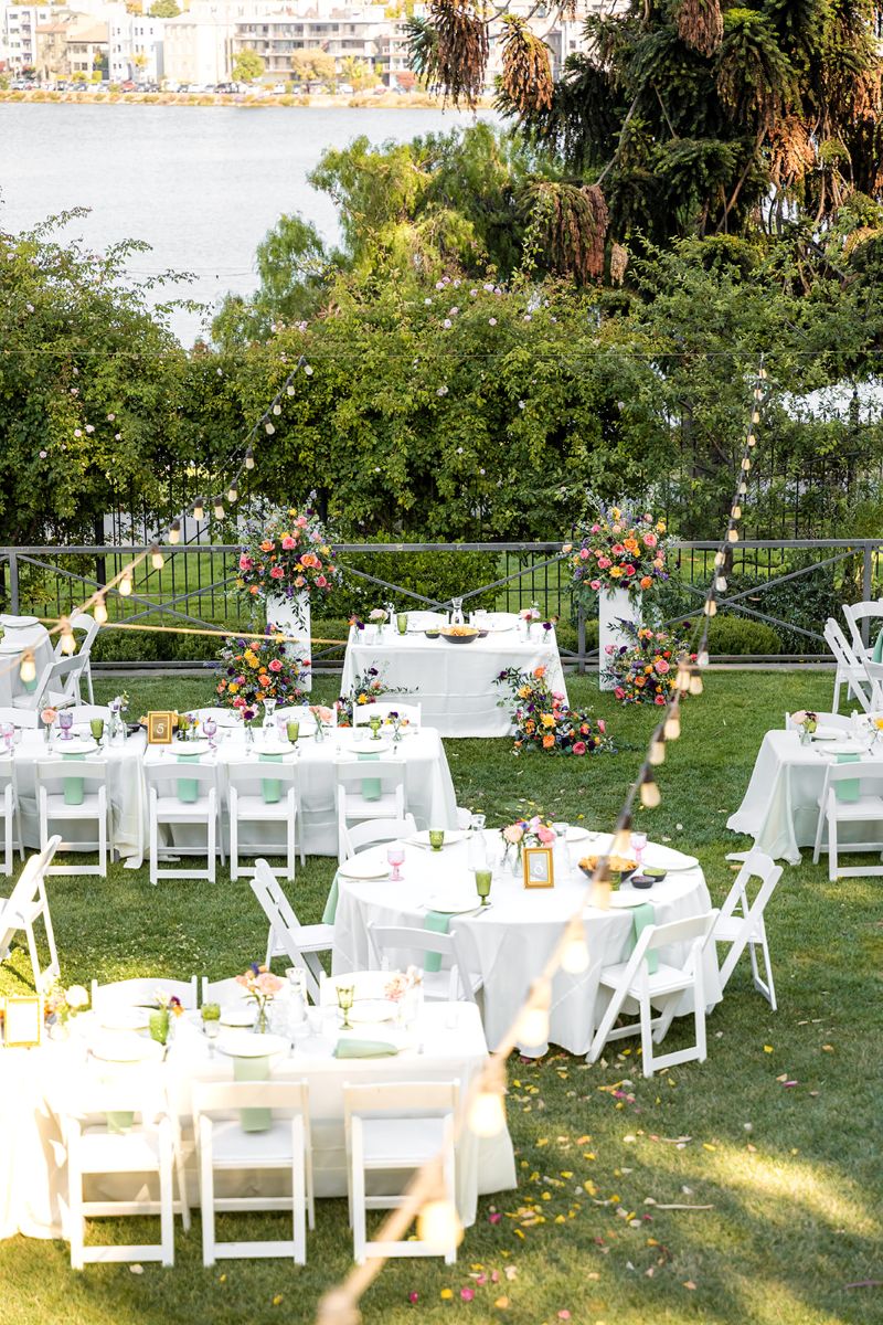 tables and chairs set up at camron stanford house for a wedding 