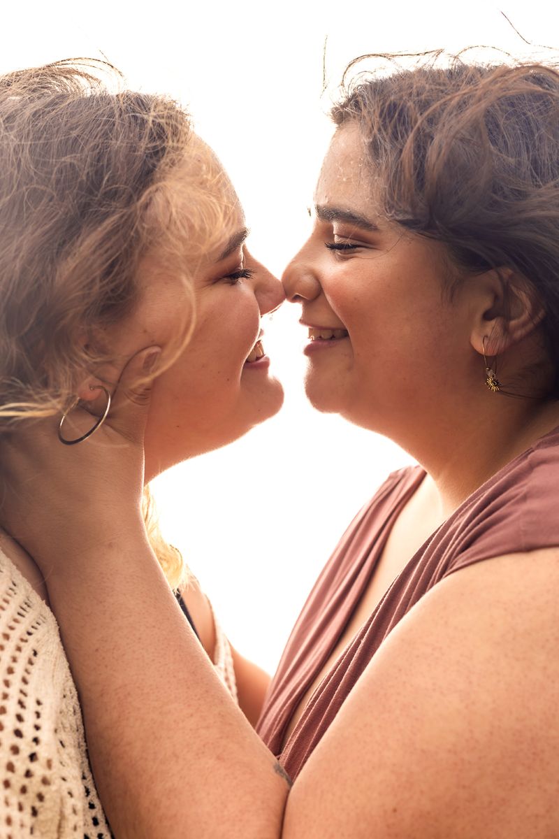 a couple leaning in to kiss each other 