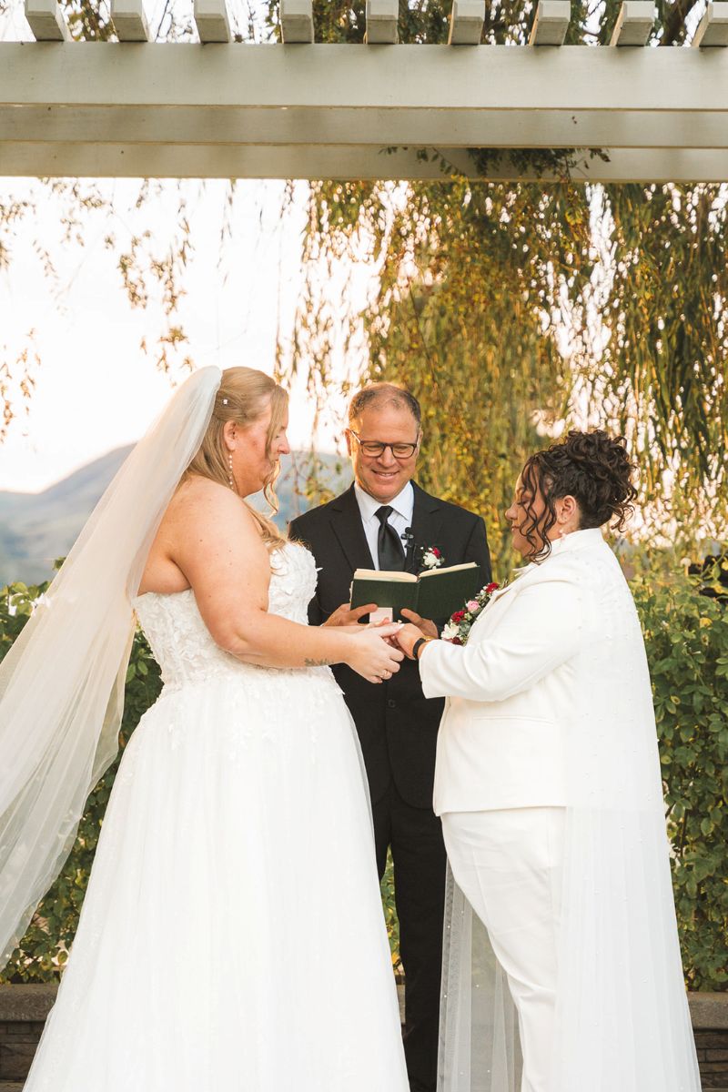 two brides having their wedding ceremony at san ramon waters
